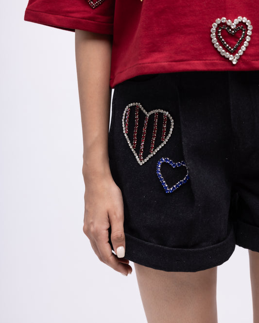 Pleated denim shorts with multi-colour embellished hearts